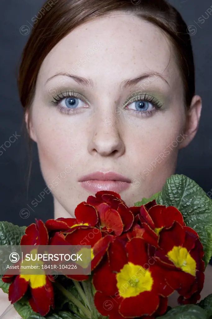 beauty woman with potted primula