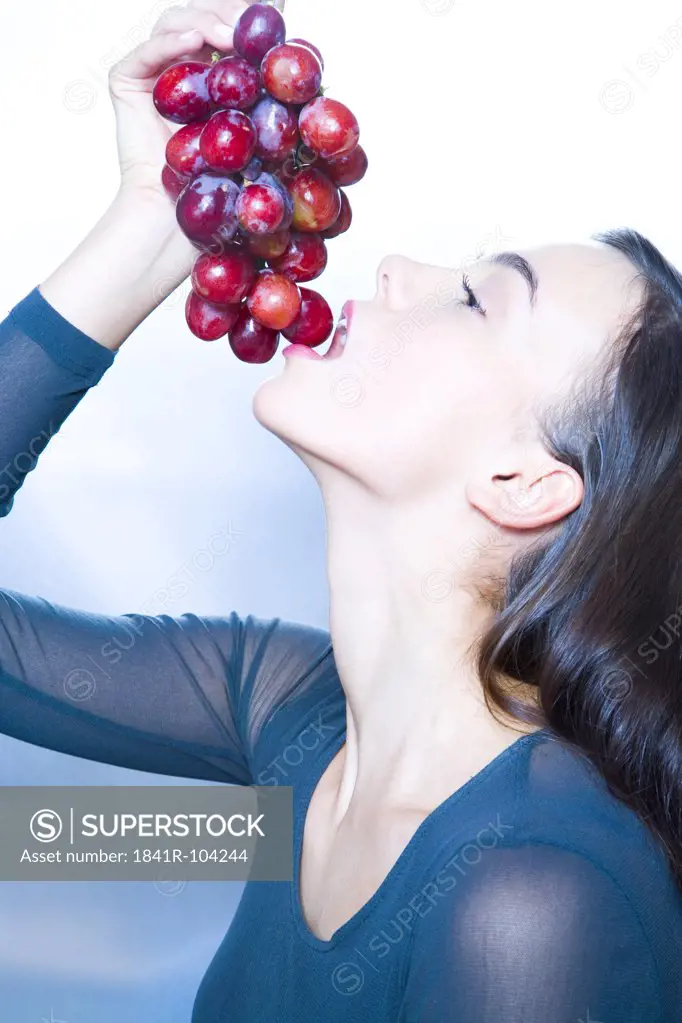 beauty young woman with grapes