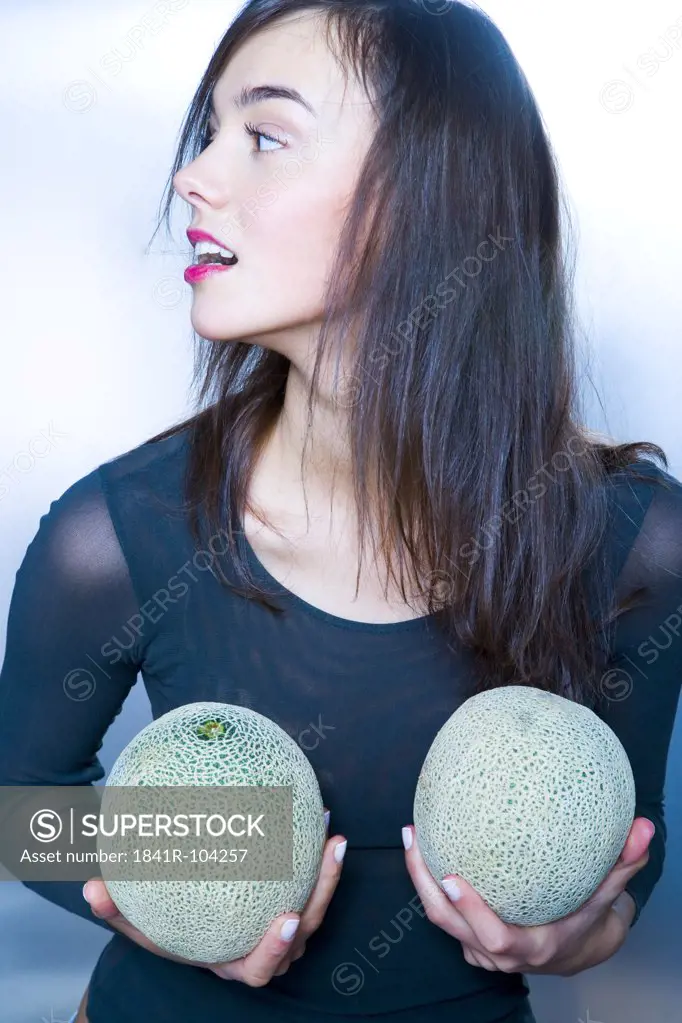 young woman with two melons