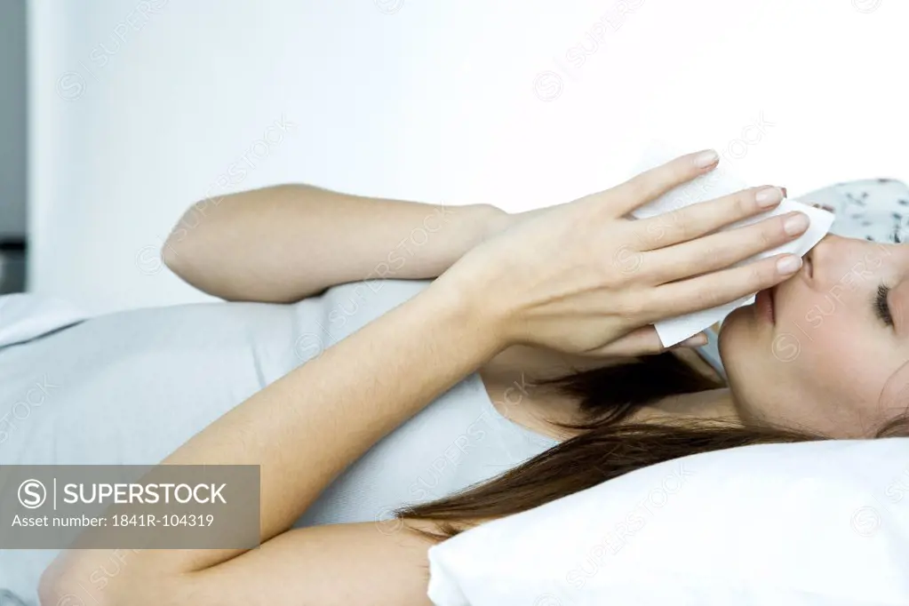 ill woman lying in bed