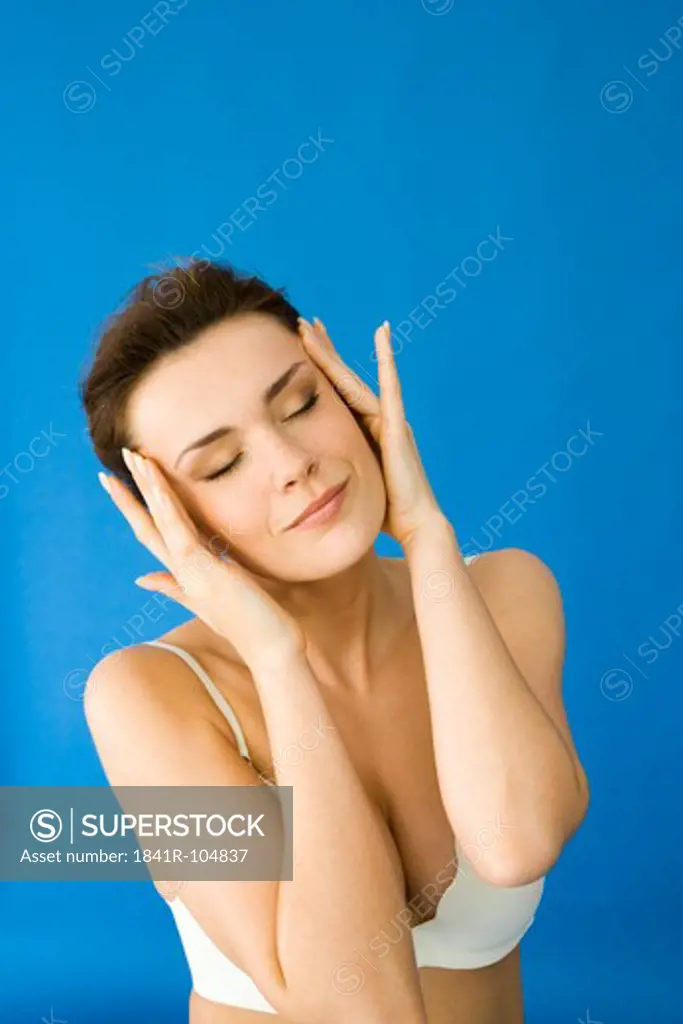 woman massaging head