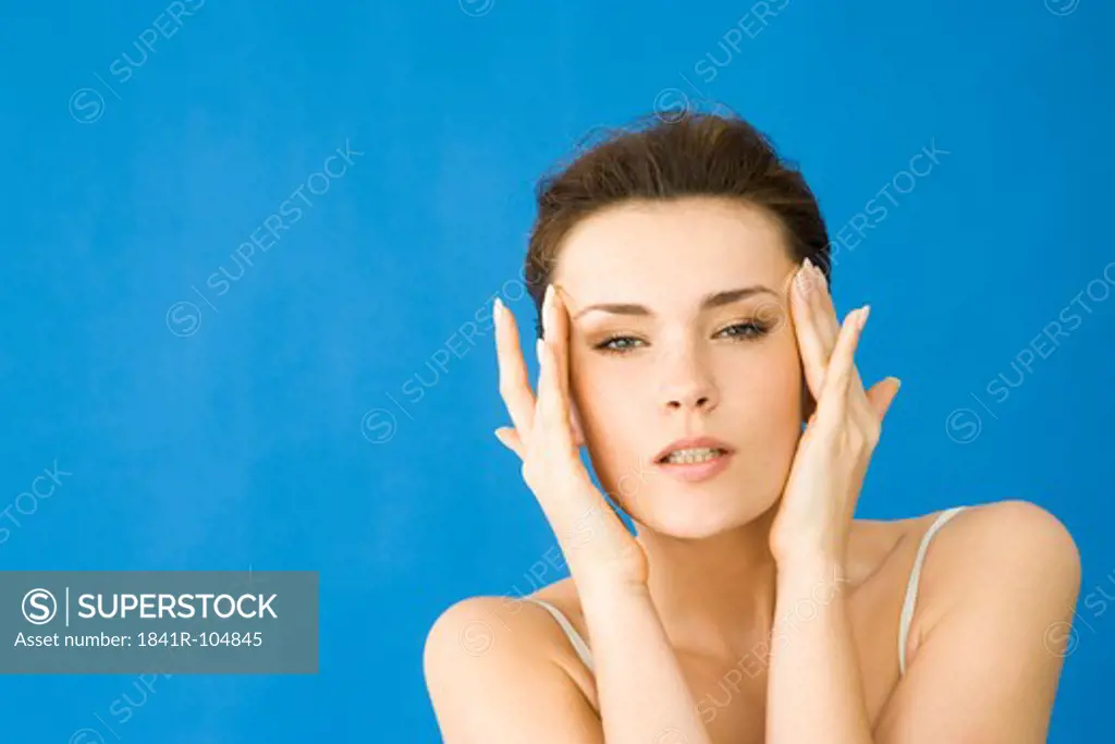 woman massaging head