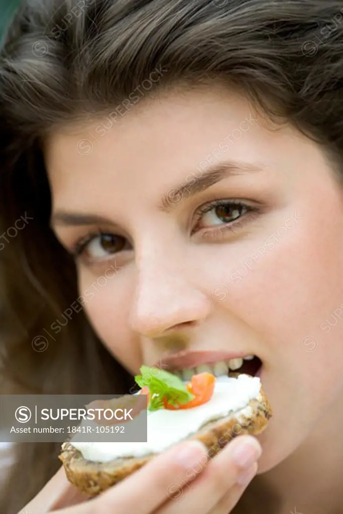 Young woman with sandwich