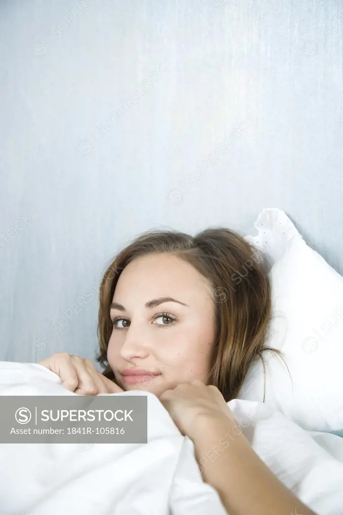 woman relaxing in bed