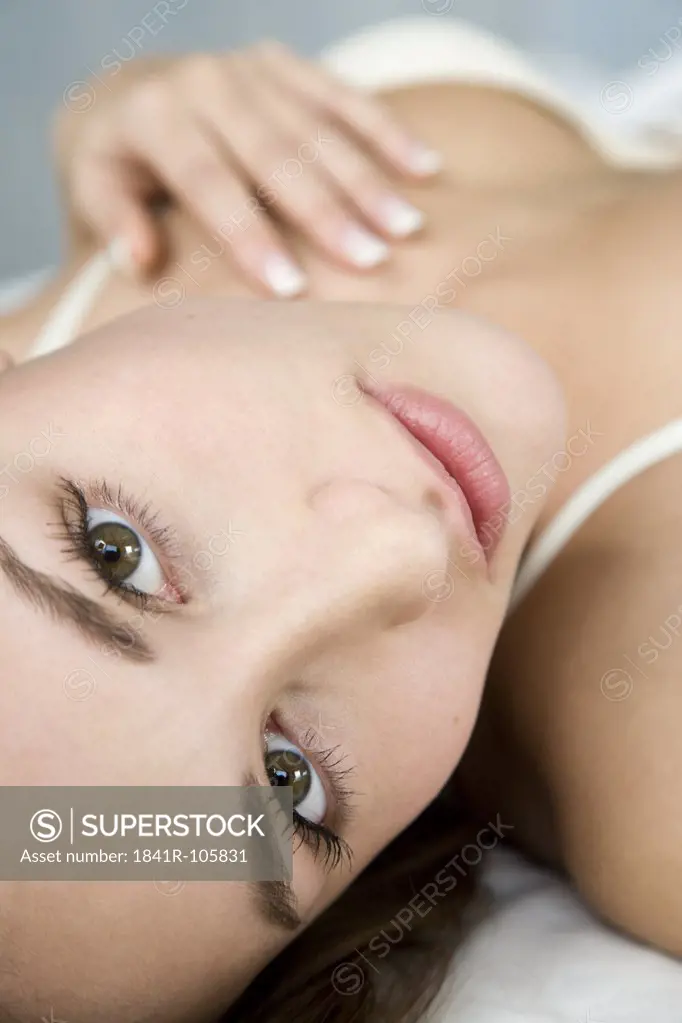 woman in underwear lying in bed