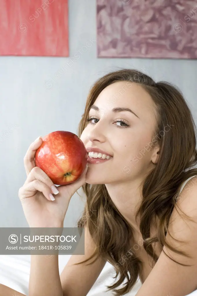 young woman with red apple
