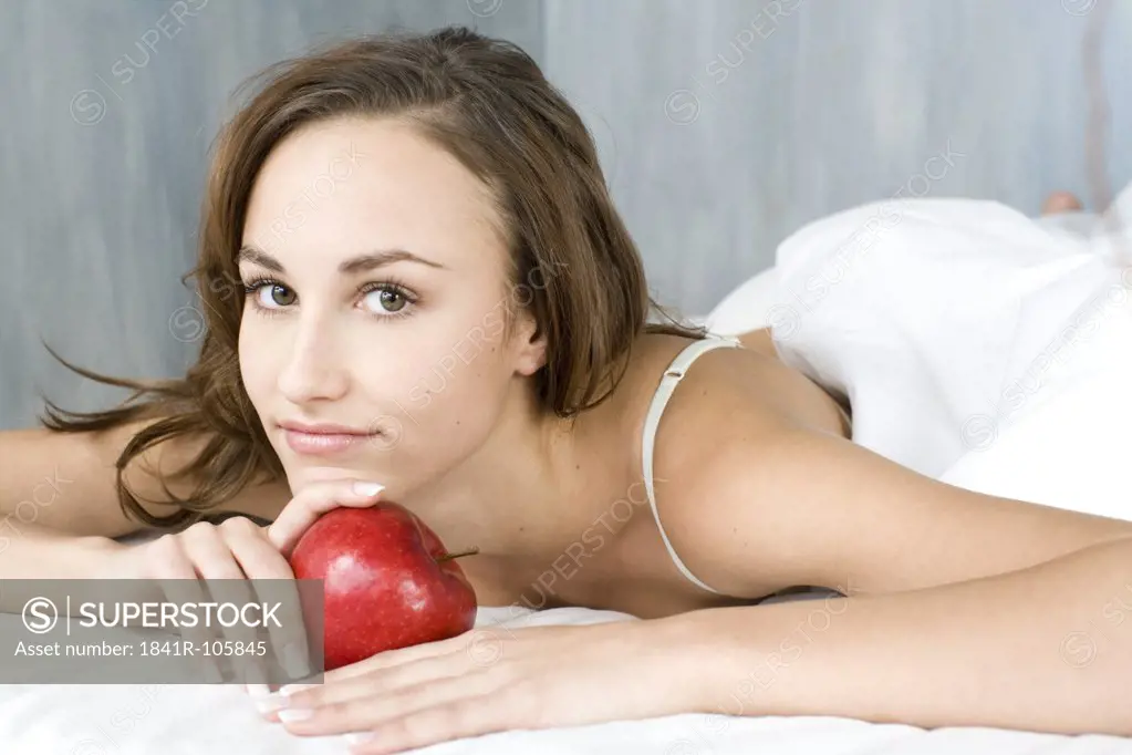 young woman with red apple