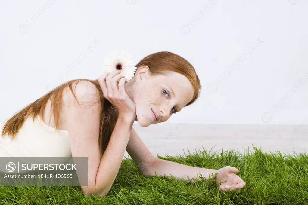 young woman relaxing on grass