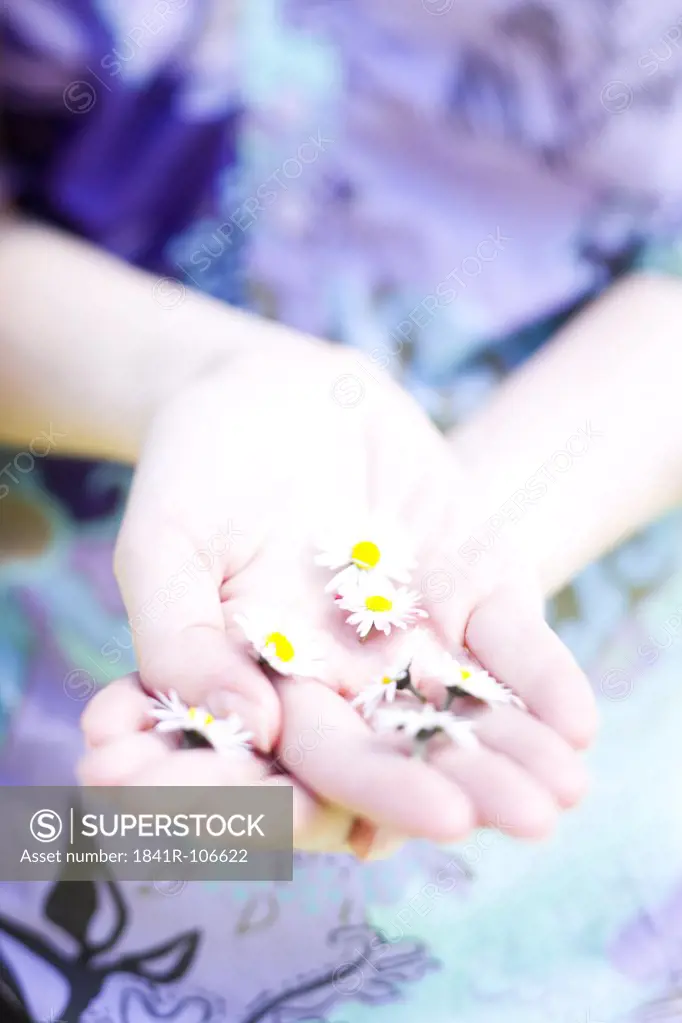 Girl picking up flowers
