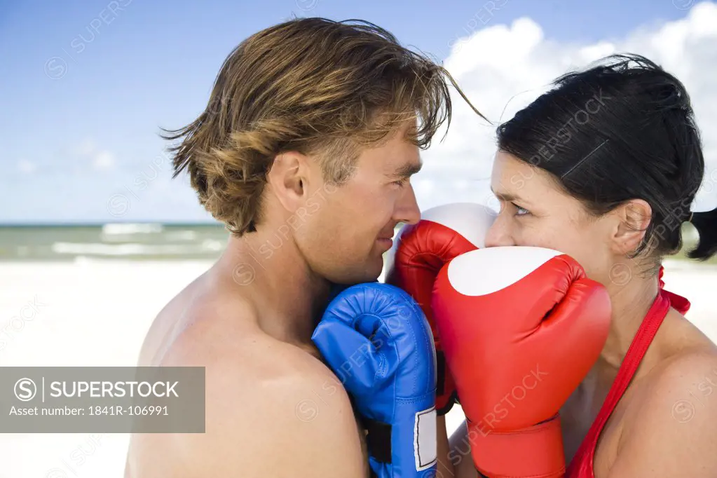 couple boxing on beach