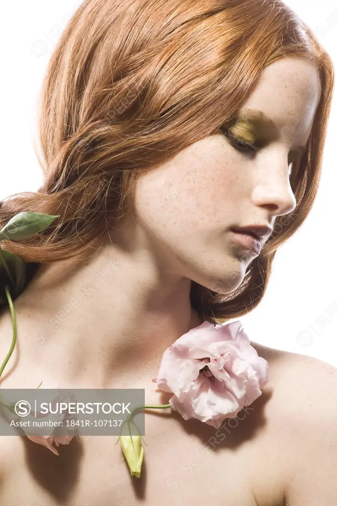 young woman with rose on neck