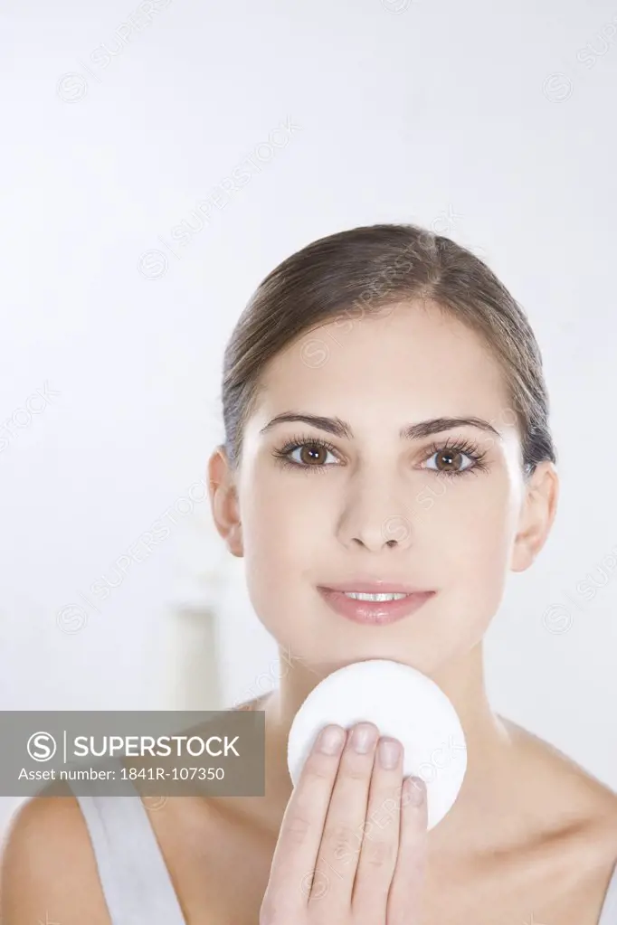 woman with cotton pad