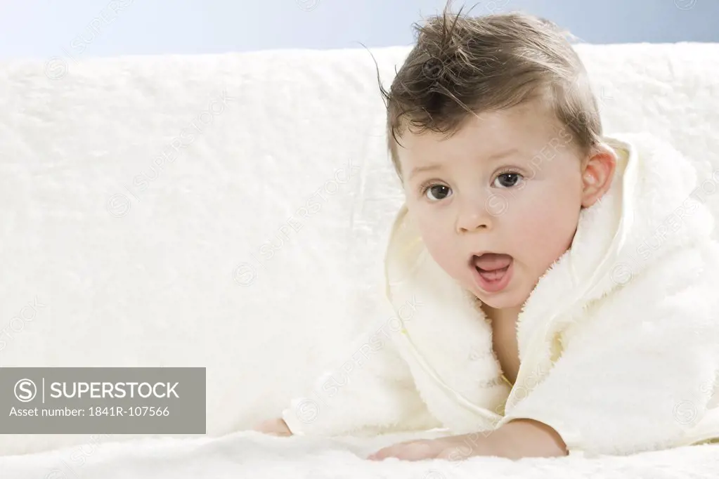 Baby in dressing gown after bath