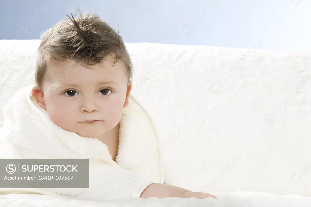 Baby in dressing gown after bath