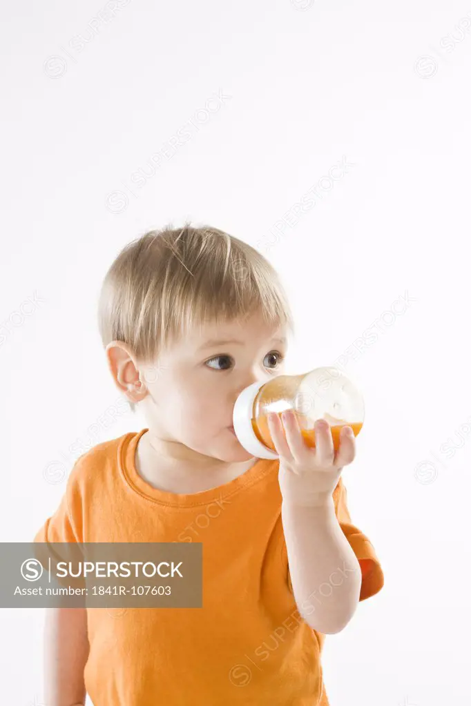 baby boy drinking carrot juice