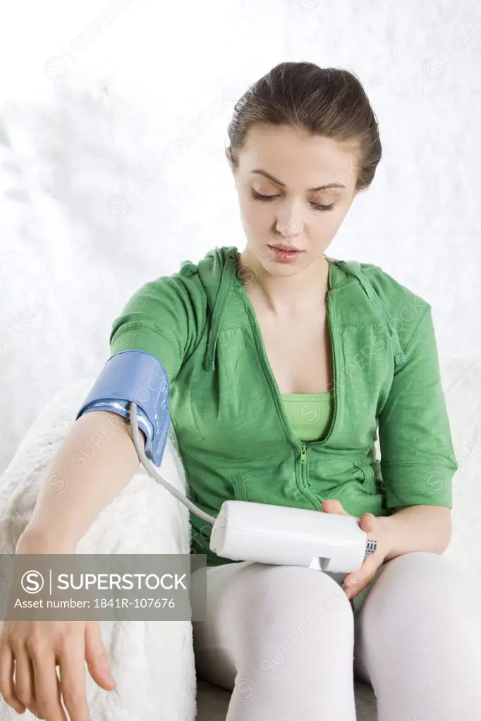 woman measuring blood preasure