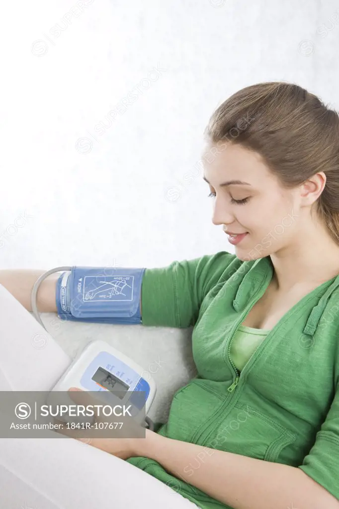 woman measuring blood preasure