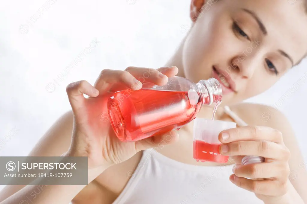 young woman pouring syrup
