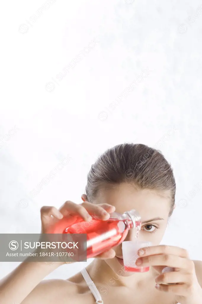 young woman pouring syrup