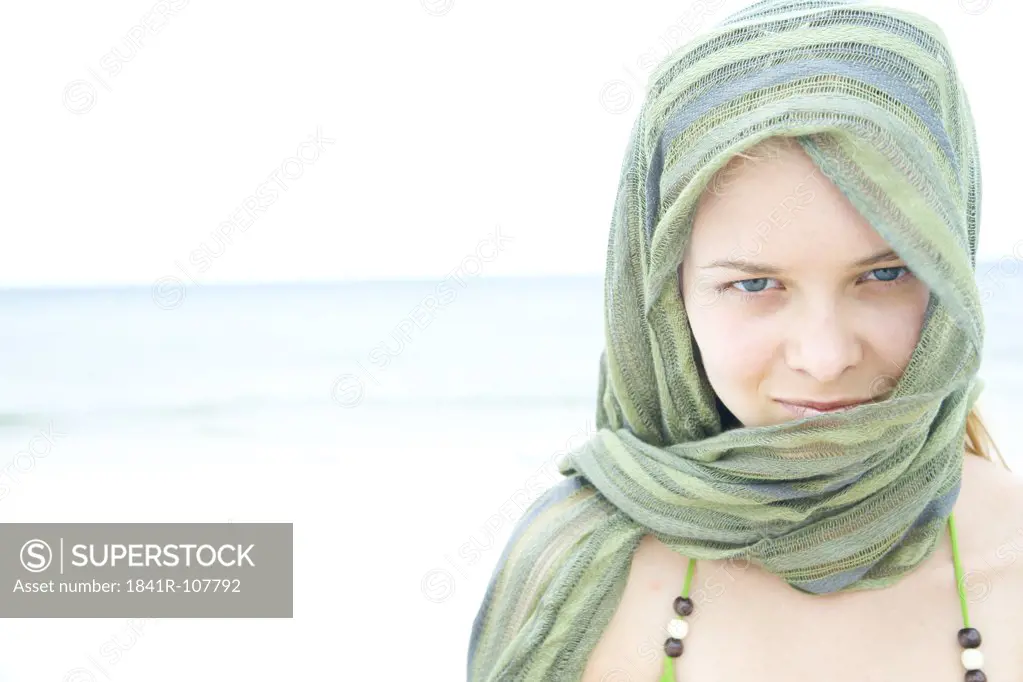 woman with scarf on the beach