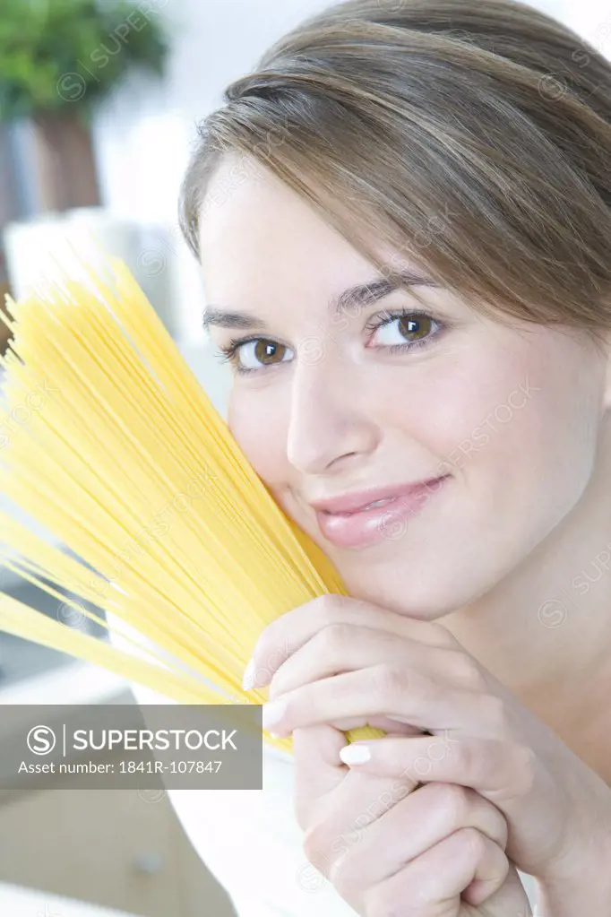 woman making spaghetti