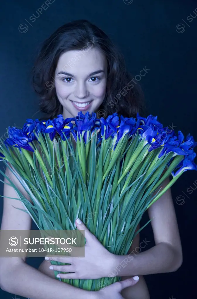 young woman with banch of irises