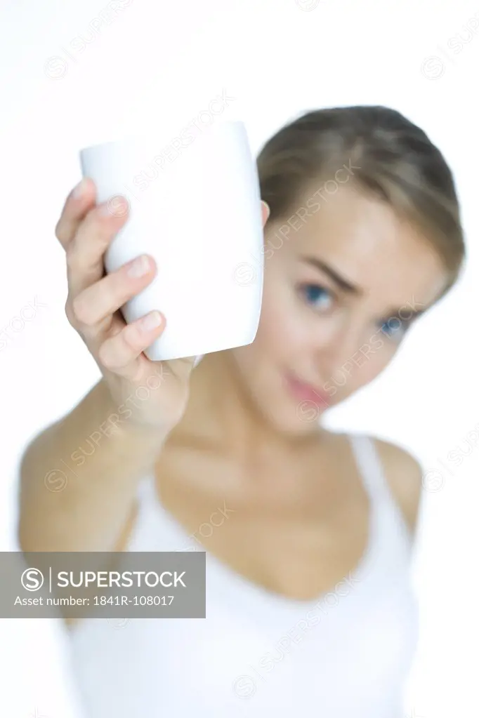 young woman holding cup