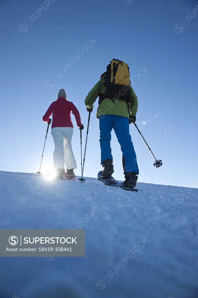 Couple snow hiking, Tannheimer Tal, Tyrol, Austria