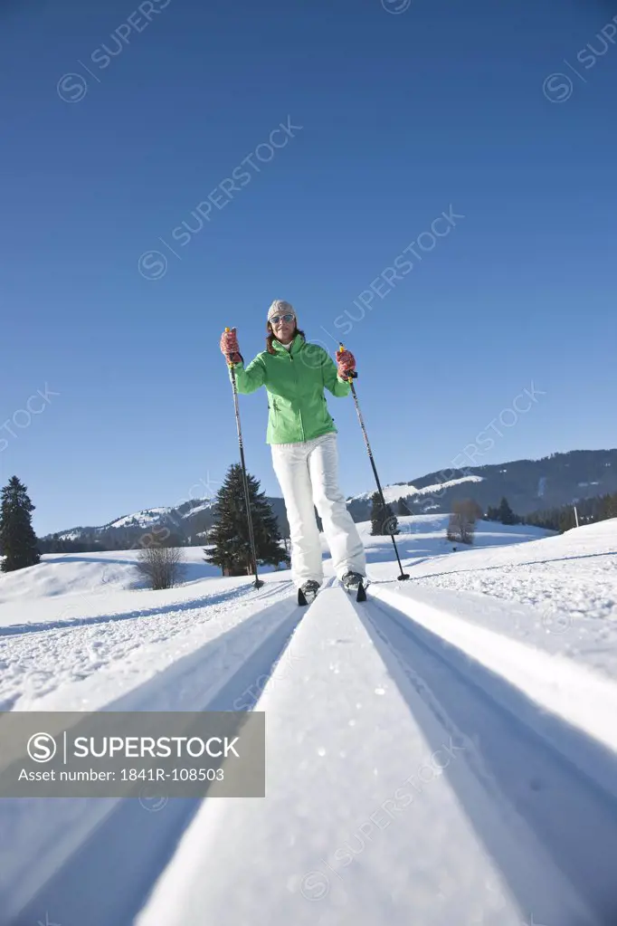 Woman cross-country skiing, Tannheimer Tal, Tyrol, Austria