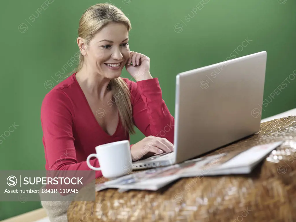Woman sitting in front of laptop