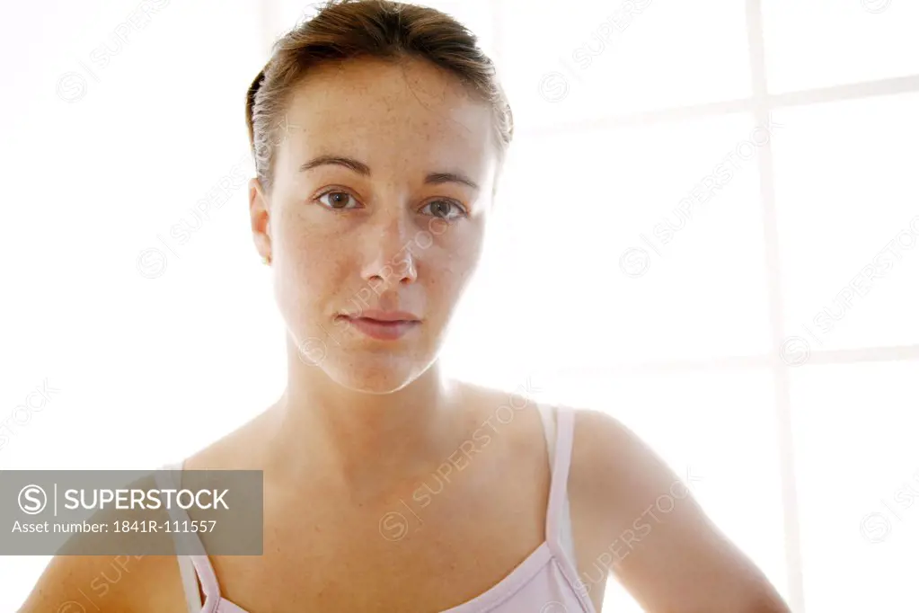 Young woman looks into camera