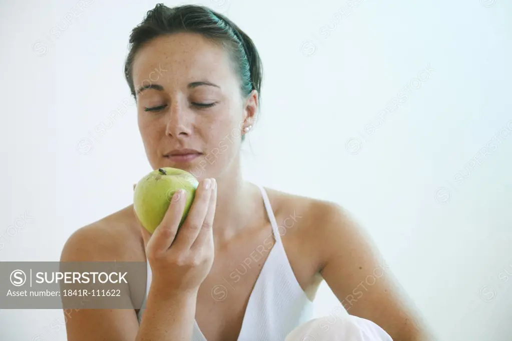Young woman with an apple.