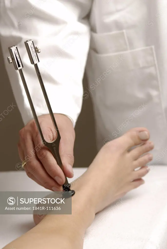 Neurology : Examination of perception of vibration with  tuning fork . On , für example , polyneuropathy this is restricted