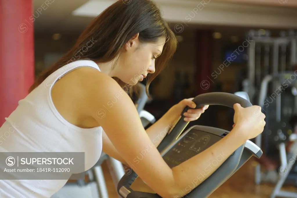 young woman at an ergometer