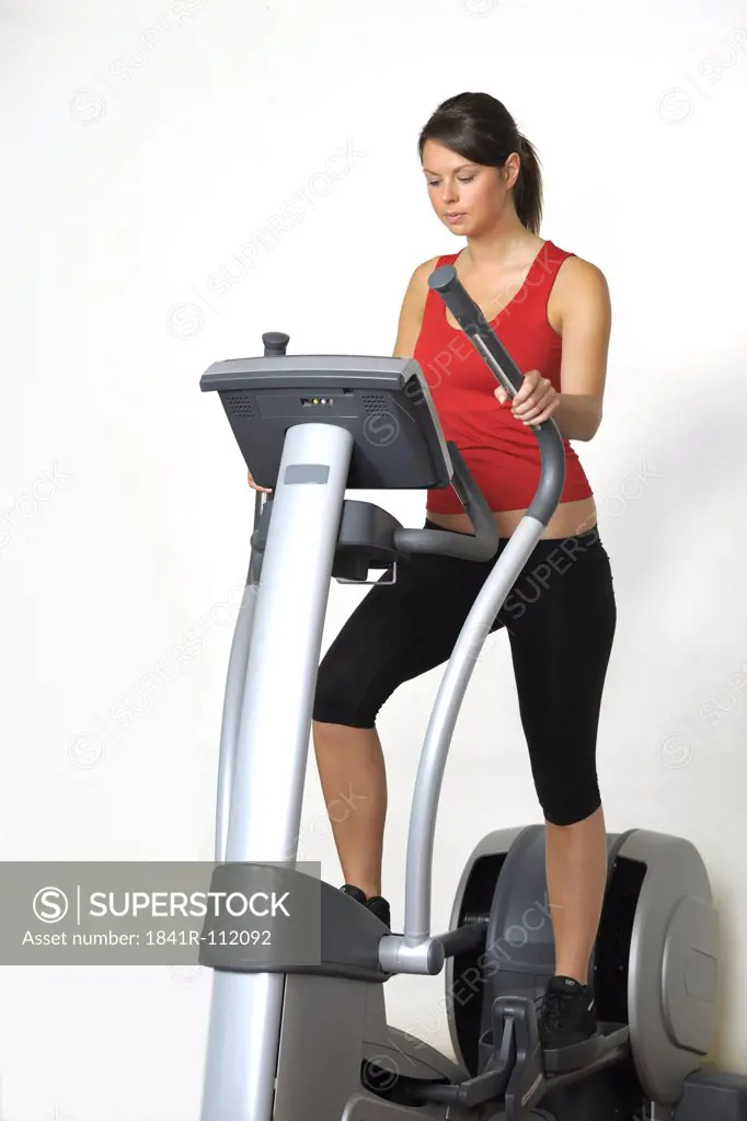 Young woman at a gym machine