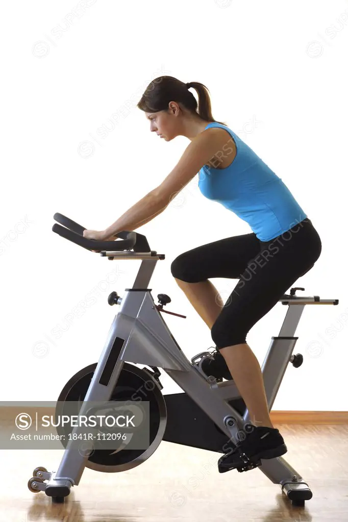 young woman at a treadmill in a fitness center