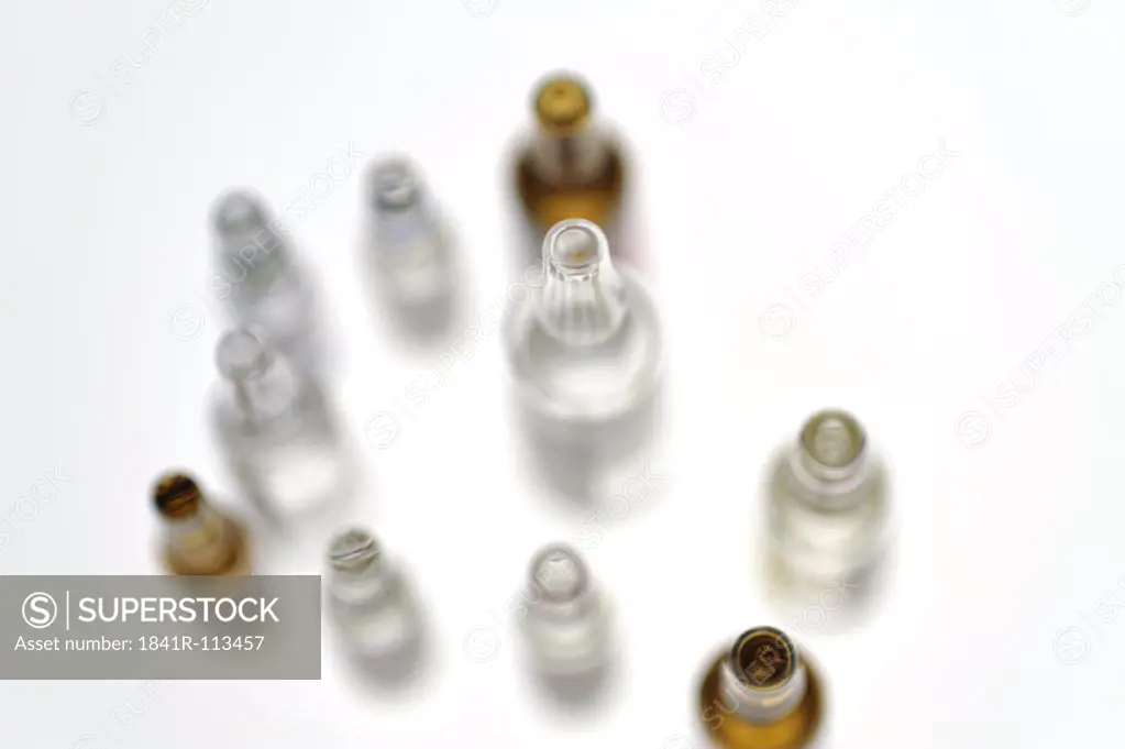 several ampoules with medicine on white