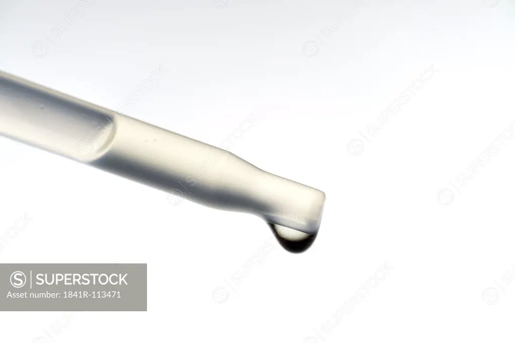 pipette with nose drops, on white