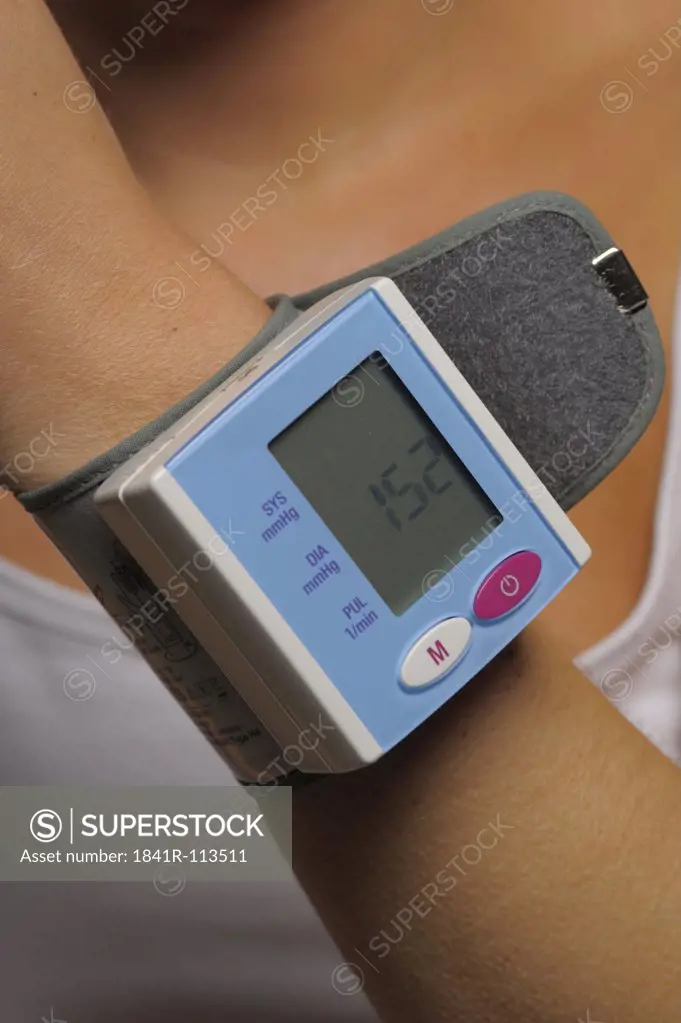 heart rate monitor on the wrist of a young woman