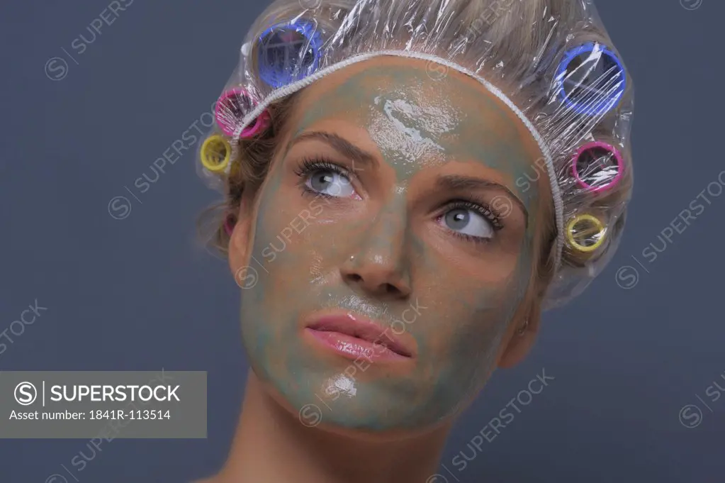 Young woman with a removable face mask