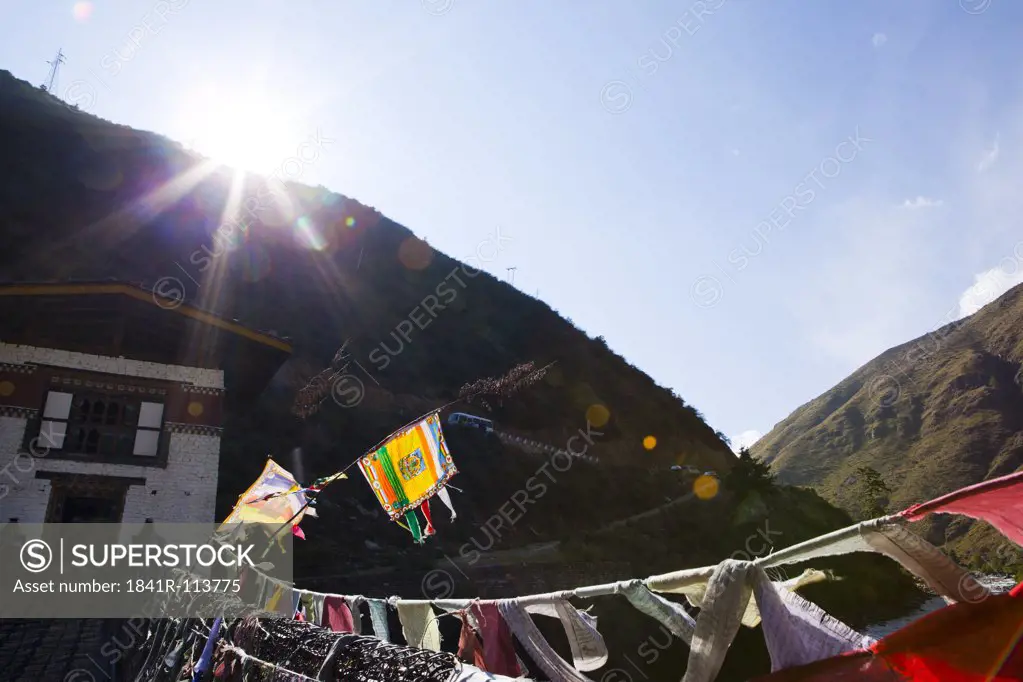 House with bridge and prayer flags, Bhutan