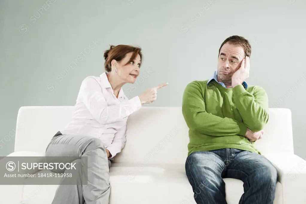 Mature couple on couch having an argument