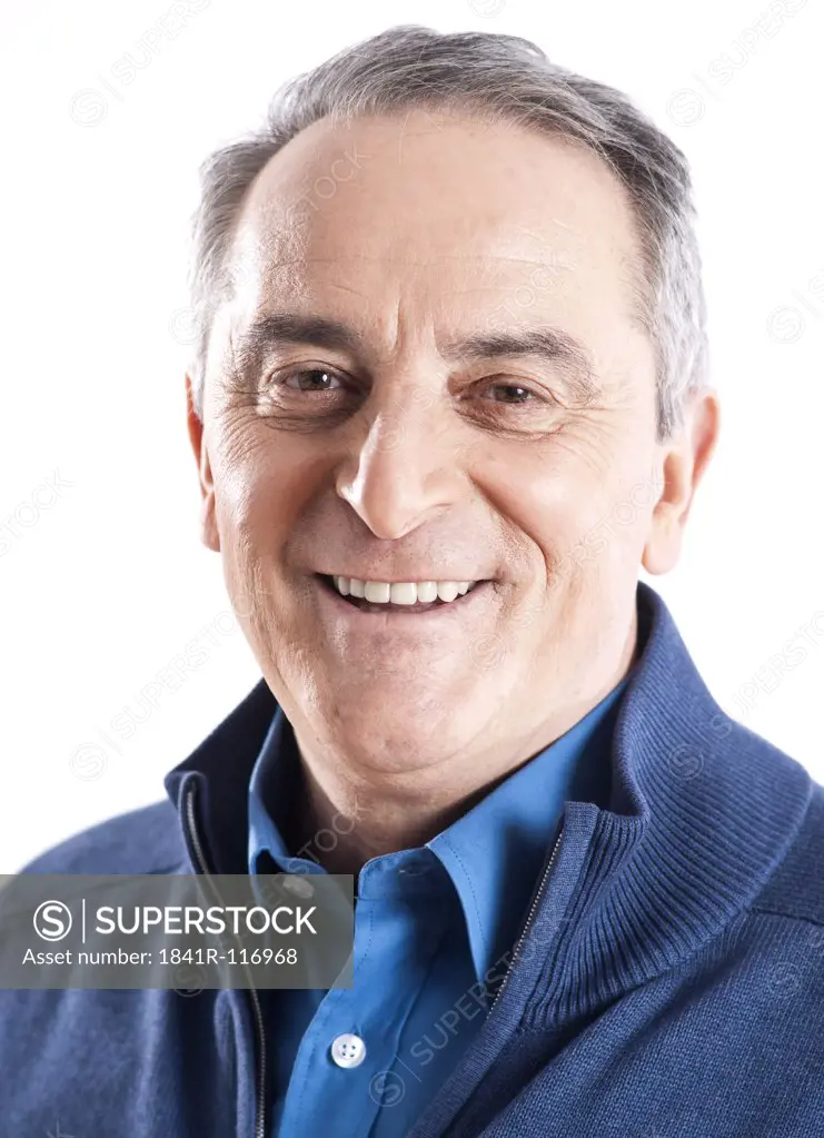 Confident senior man wearing blue cardigan, portrait