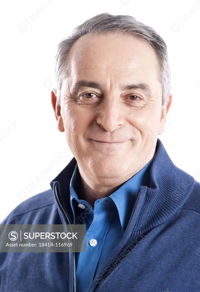 Confident senior man wearing blue cardigan, portrait