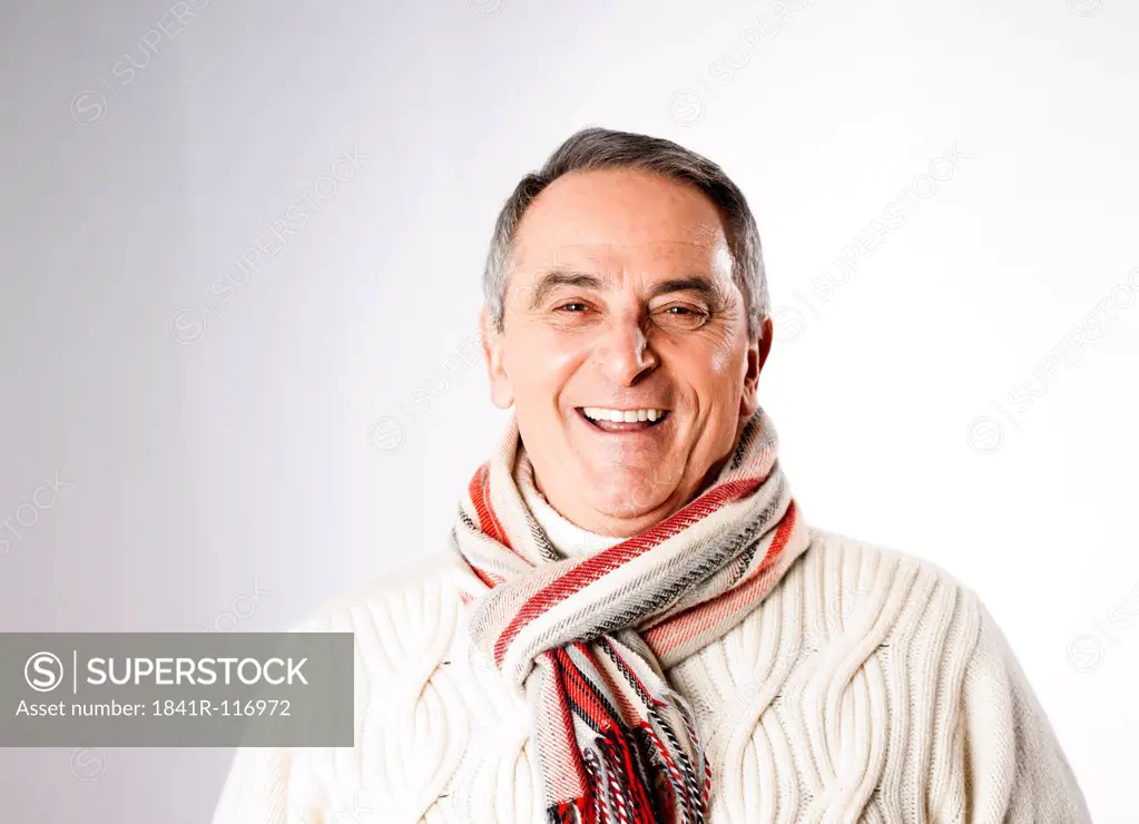 Happy senior man in winter clothes, portrait