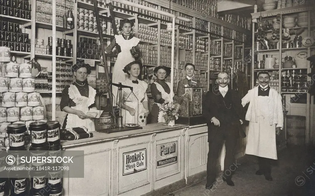 Historical picture of a shop keeper with employees