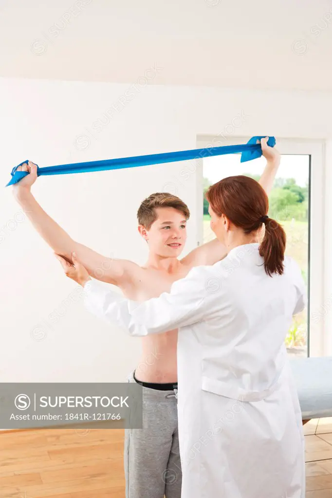 Male teenage boy at female doctor