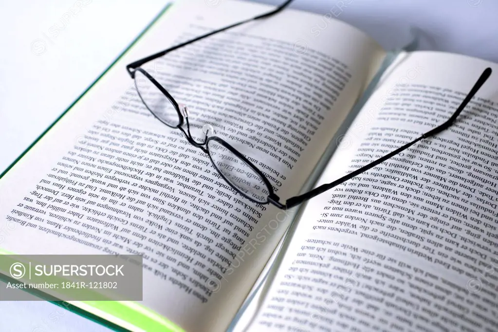 Book and reading glasses