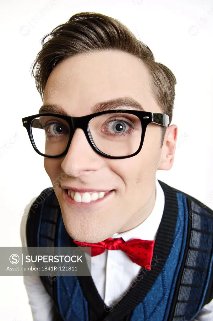 Man with glasses pulling faces
