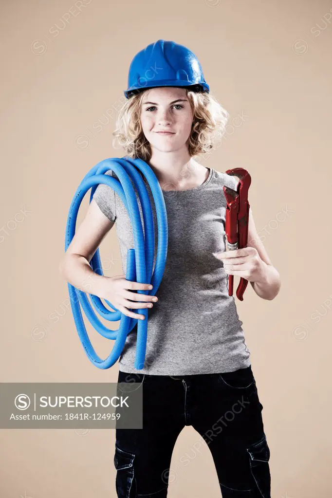 Teenage girl with hard helm and tube